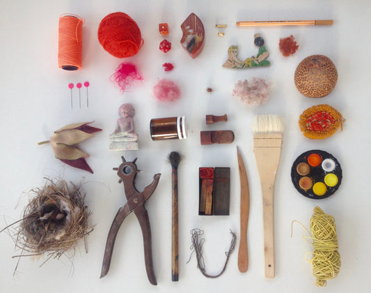 Various craft utensils and tools laid out flat