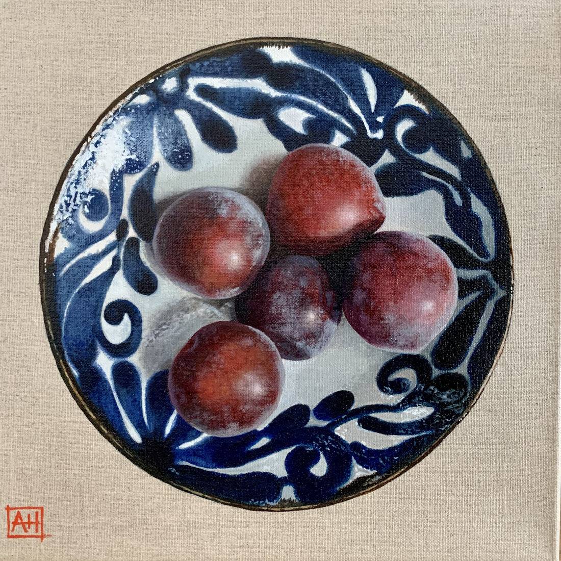 Bird's eye view painting of five plums in a ceramic bowl with blue glaze details on the rim